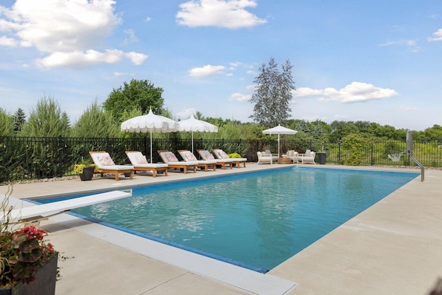 7568 Glen Alcove, Woodbury, MN 55129 - view of swimming pool featuring a patio area and a diving board