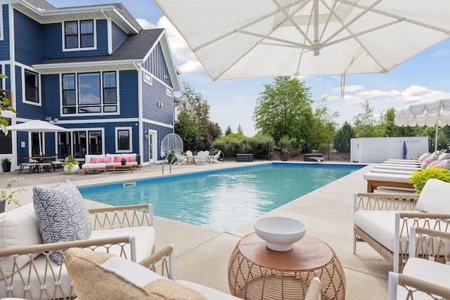 7568 Glen Alcove, Woodbury, MN 55129 - view of swimming pool with outdoor lounge area and a patio