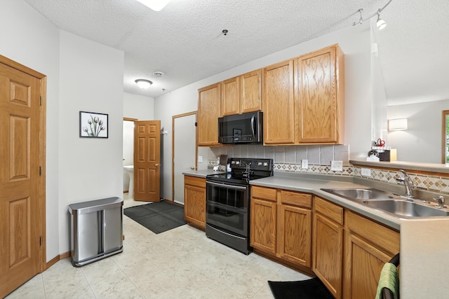 451 Frederick Cir Unit 1405, Hastings, MN 55033 - kitchen with black appliances, tasteful backsplash, light countertops, a textured ceiling, and light floors