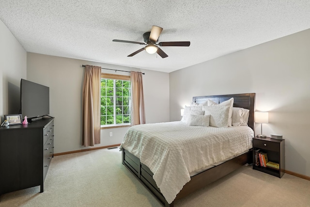 451 Frederick Cir Unit 1405, Hastings, MN 55033 - bedroom with light carpet, a ceiling fan, and a textured ceiling