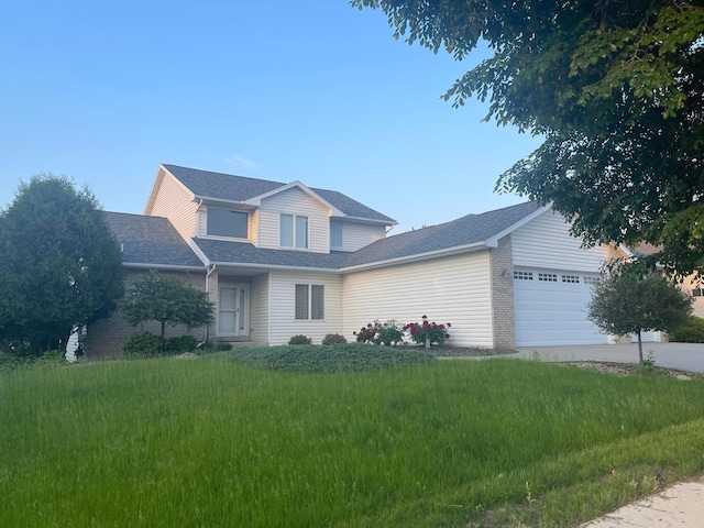 5182 Southern Ridge Ln SW, Rochester, MN 55902 - traditional-style house featuring a front yard, driveway, an attached garage, and brick siding