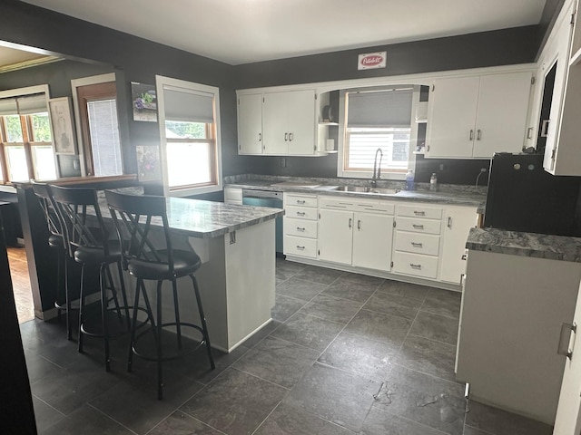 1520 6th St, Montevideo, MN 56265 - kitchen featuring dishwasher, plenty of natural light, open shelves, and white cabinets