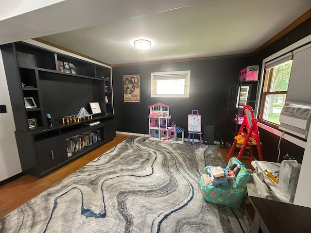 1520 6th St, Montevideo, MN 56265 - game room featuring plenty of natural light, wood finished floors, crown molding, and cooling unit