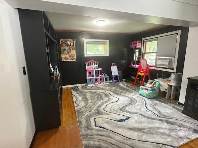 1520 6th St, Montevideo, MN 56265 - playroom featuring cooling unit, wood finished floors, and plenty of natural light