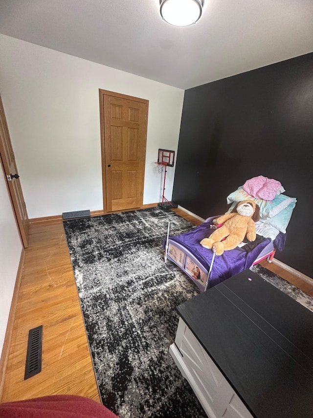 1520 6th St, Montevideo, MN 56265 - bedroom with baseboards and wood finished floors