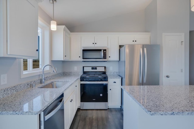 19943 English Ln N, Forest Lake, MN 55025 - kitchen featuring appliances with stainless steel finishes, dark wood-style floors, white cabinetry, vaulted ceiling, and light stone counters