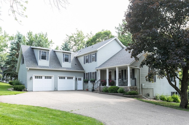 6045 Galpin Lake Rd, Shorewood, MN 55331 - view of front of house featuring a porch, a garage, roof with shingles, and concrete driveway