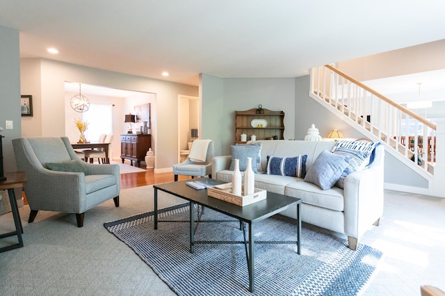 6045 Galpin Lake Rd, Shorewood, MN 55331 - living area with stairs, recessed lighting, carpet floors, and a chandelier