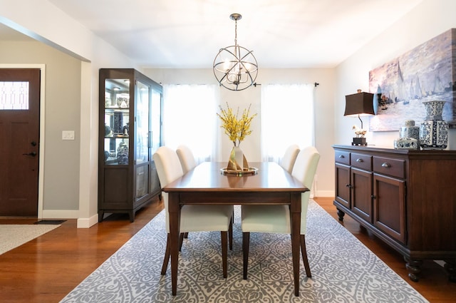 6045 Galpin Lake Rd, Shorewood, MN 55331 - dining room featuring a chandelier and dark wood finished floors