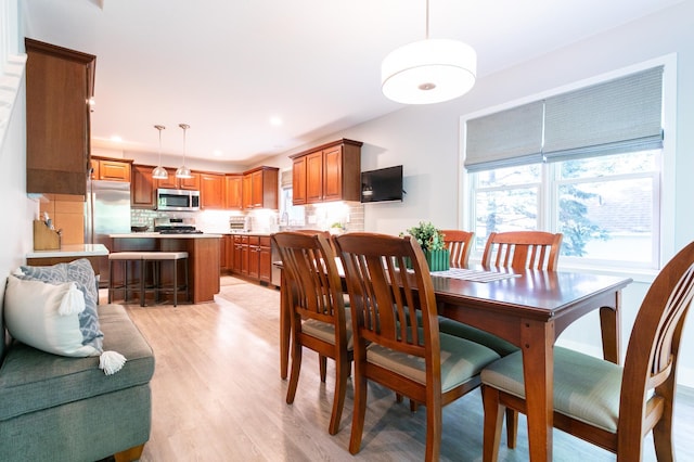6045 Galpin Lake Rd, Shorewood, MN 55331 - dining space featuring light wood-style floors and recessed lighting
