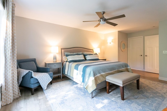 6045 Galpin Lake Rd, Shorewood, MN 55331 - bedroom featuring wood finished floors and a ceiling fan