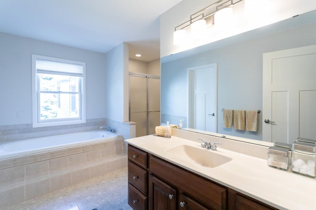 6045 Galpin Lake Rd, Shorewood, MN 55331 - full bathroom featuring vanity, a garden tub, a stall shower, tile patterned flooring, and recessed lighting