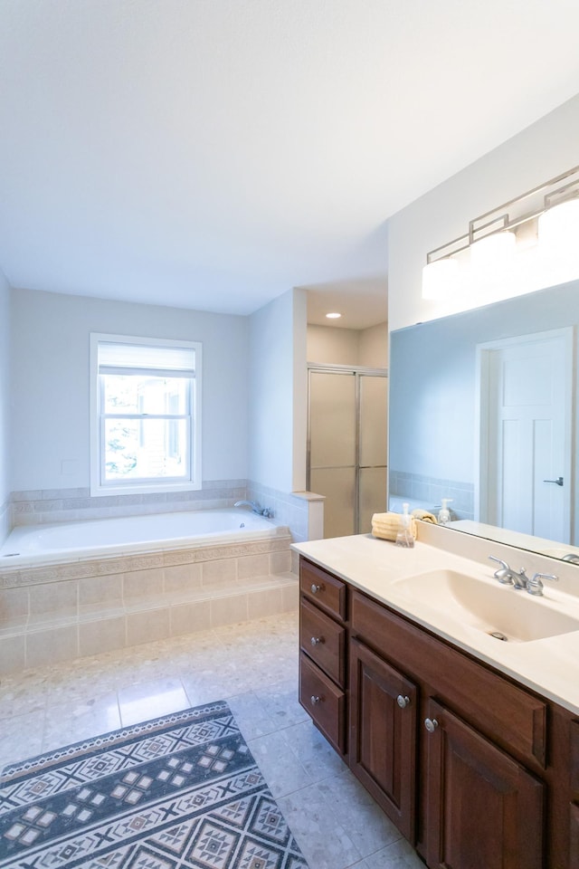 6045 Galpin Lake Rd, Shorewood, MN 55331 - bathroom with vanity, a bath, a stall shower, and tile patterned floors