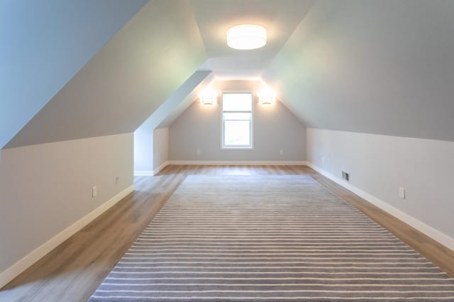 6045 Galpin Lake Rd, Shorewood, MN 55331 - bonus room featuring wood finished floors and vaulted ceiling