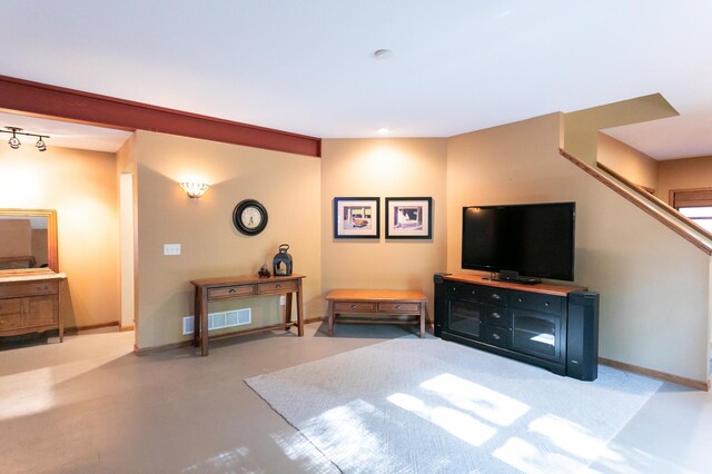 6045 Galpin Lake Rd, Shorewood, MN 55331 - living area featuring stairway and concrete flooring