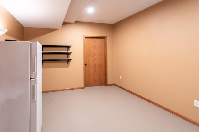 6045 Galpin Lake Rd, Shorewood, MN 55331 - basement featuring freestanding refrigerator and baseboards