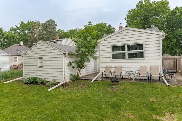 1130 4th Ave SE, Rochester, MN 55904 - rear view of property featuring an outdoor fire pit and a chimney