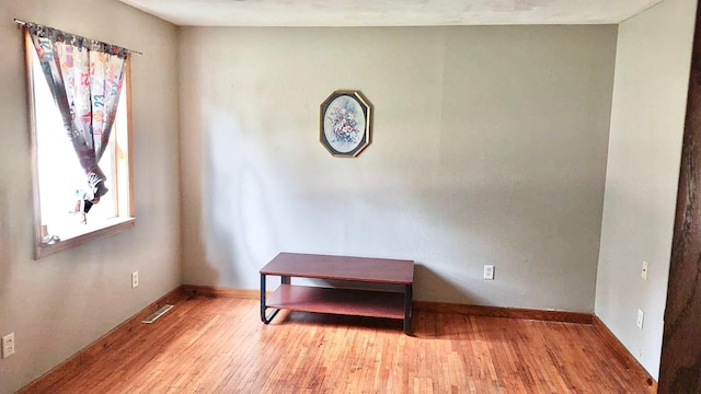 901 Prince St, Mountain Lake, MN 56159 - unfurnished room with wood finished floors and baseboards