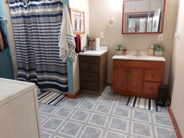 901 Prince St, Mountain Lake, MN 56159 - full bathroom featuring vanity, washer / clothes dryer, and tile patterned floors