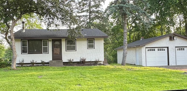 2325 Crosstown Blvd NE, Ham Lake, MN 55304 - single story home with entry steps, a front yard, an outdoor structure, and a detached garage