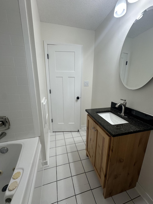 2325 Crosstown Blvd NE, Ham Lake, MN 55304 - full bath featuring vanity, tile patterned flooring, and a textured ceiling