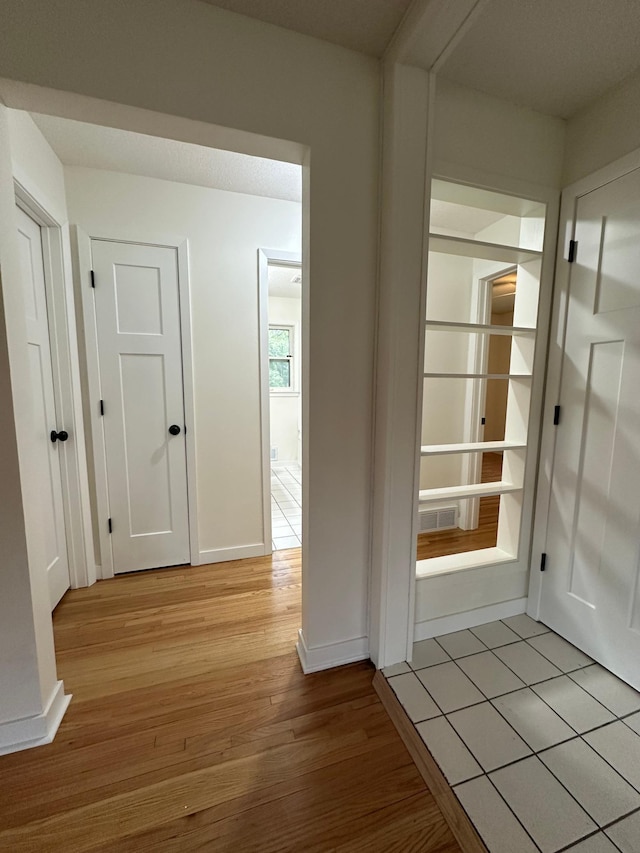 2325 Crosstown Blvd NE, Ham Lake, MN 55304 - hallway featuring light wood-style floors and baseboards