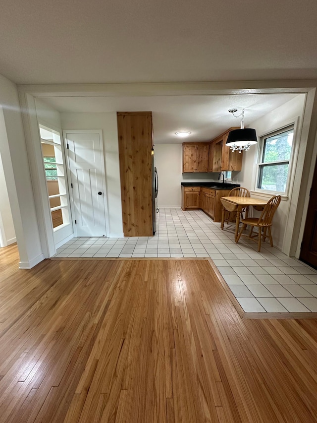 2325 Crosstown Blvd NE, Ham Lake, MN 55304 - living area with light wood finished floors and a chandelier