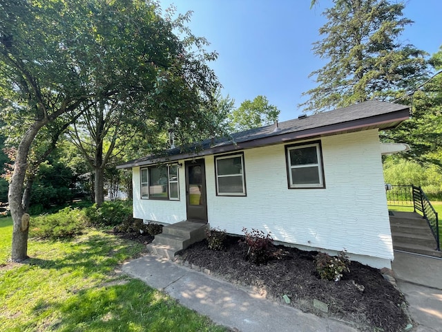 2325 Crosstown Blvd NE, Ham Lake, MN 55304 - view of front of home with a front lawn and brick siding
