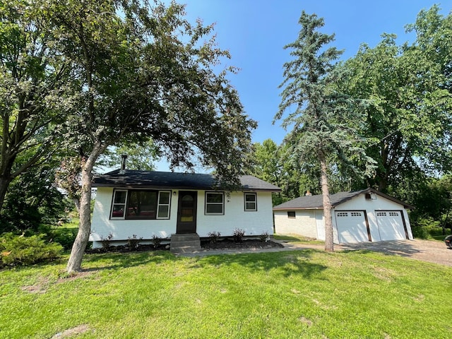 2325 Crosstown Blvd NE, Ham Lake, MN 55304 - view of front facade with a detached garage, an outbuilding, a front yard, and entry steps
