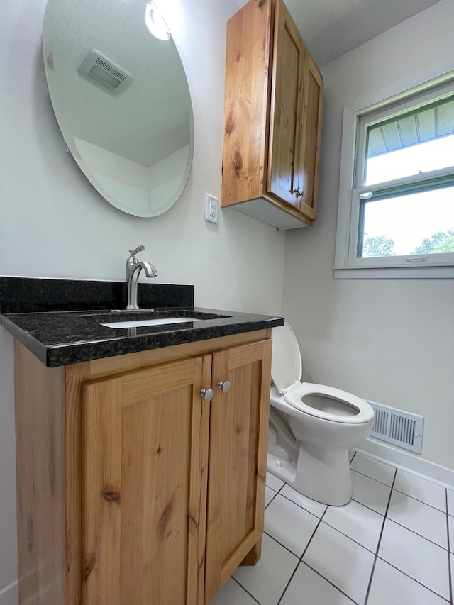 2325 Crosstown Blvd NE, Ham Lake, MN 55304 - half bath featuring vanity and tile patterned flooring