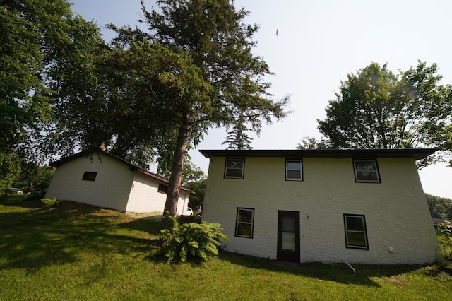 2325 Crosstown Blvd NE, Ham Lake, MN 55304 - rear view of property with a yard
