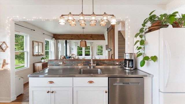21038 Lace Ave, Hutchinson, MN 55350 - kitchen featuring stainless steel countertops, stainless steel dishwasher, freestanding refrigerator, white cabinetry, and hanging light fixtures