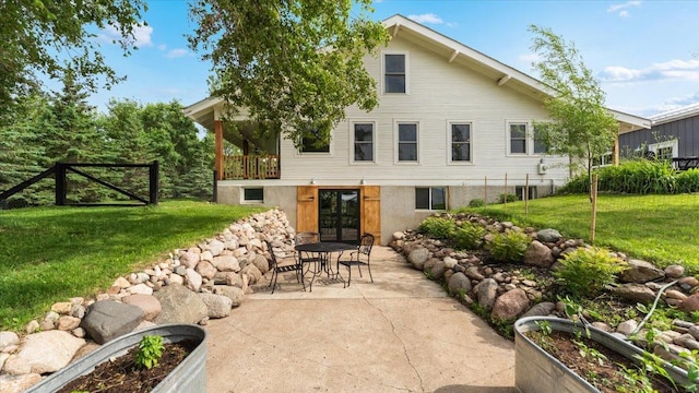 21038 Lace Ave, Hutchinson, MN 55350 - rear view of house featuring a lawn, a patio area, and french doors