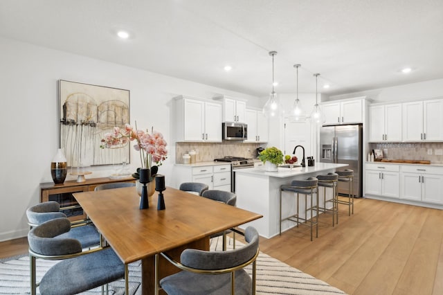 7579 Swan St, Lino Lakes, MN 55038 - dining space featuring light wood-style floors and recessed lighting
