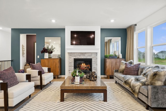 7579 Swan St, Lino Lakes, MN 55038 - living area with a stone fireplace, recessed lighting, and light wood finished floors