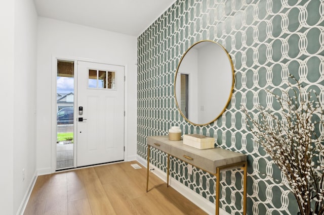 7579 Swan St, Lino Lakes, MN 55038 - foyer entrance featuring wood finished floors and wallpapered walls