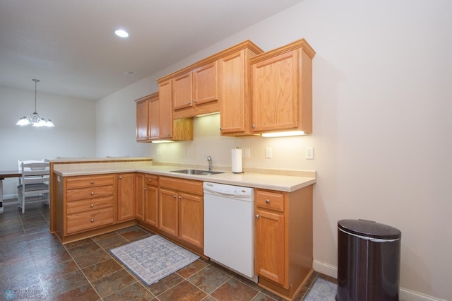 508 19th Ave W Unit C, West Fargo, ND 58078 - kitchen featuring white dishwasher, a peninsula, a chandelier, light countertops, and dark stone finish flooring