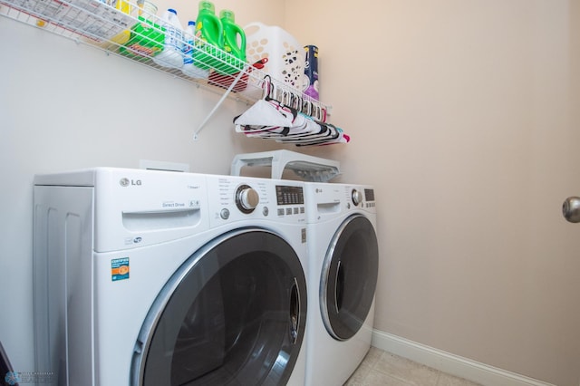 508 19th Ave W Unit C, West Fargo, ND 58078 - laundry room with washing machine and clothes dryer and light tile patterned flooring