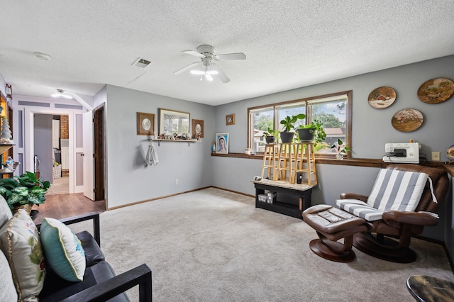 1613 Lyn Curve Ave N, Minneapolis, MN 55411 - living area featuring a ceiling fan, carpet floors, and a textured ceiling