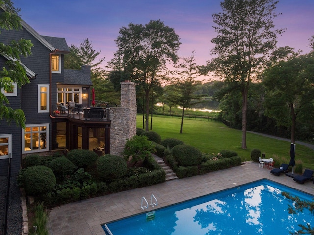 849 Brown Rd N, Orono, MN 55356 - pool at dusk with a yard, a patio, and an outdoor pool