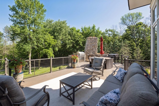 849 Brown Rd N, Orono, MN 55356 - view of patio / terrace with outdoor dining area, a wooden deck, and an outdoor living space with a fireplace