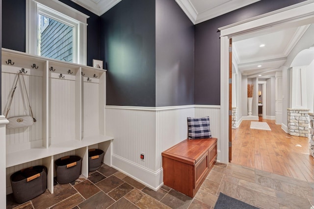 849 Brown Rd N, Orono, MN 55356 - mudroom featuring crown molding, stone tile flooring, and a wainscoted wall