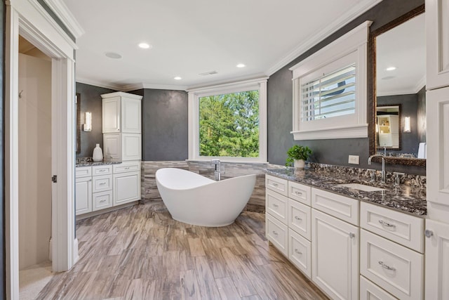 849 Brown Rd N, Orono, MN 55356 - bathroom with ornamental molding, vanity, a freestanding tub, and recessed lighting