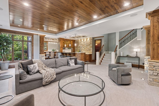849 Brown Rd N, Orono, MN 55356 - carpeted living area with wooden ceiling, a tray ceiling, recessed lighting, stairs, and bar