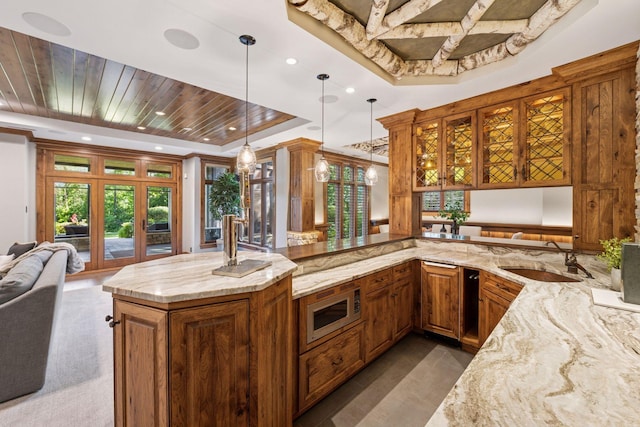 849 Brown Rd N, Orono, MN 55356 - kitchen with open floor plan, stainless steel microwave, a tray ceiling, light stone counters, and wood ceiling