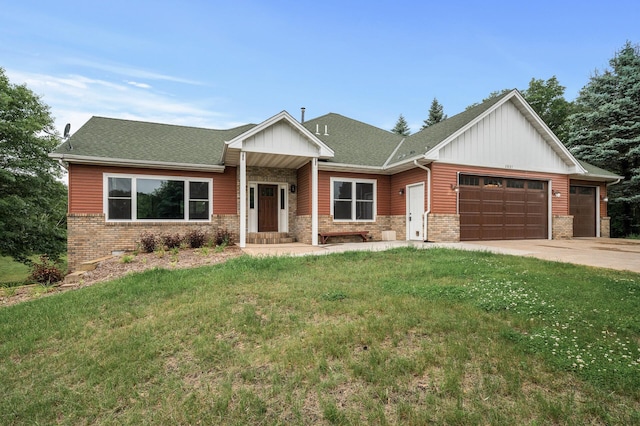 2801 263rd Ave NE, Isanti, MN 55040 - view of front facade featuring a garage, concrete driveway, a front yard, board and batten siding, and brick siding