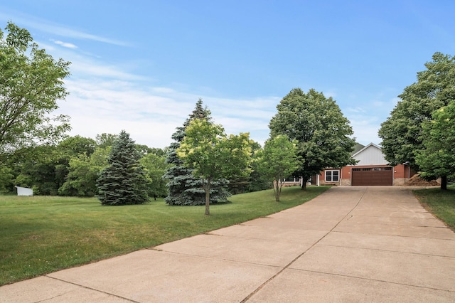 2801 263rd Ave NE, Isanti, MN 55040 - view of front of property featuring a garage, driveway, and a front yard
