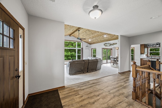 2801 263rd Ave NE, Isanti, MN 55040 - entryway with wood finished floors, a ceiling fan, and a textured ceiling