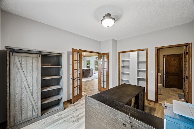 2801 263rd Ave NE, Isanti, MN 55040 - walk in closet featuring french doors and light wood-type flooring