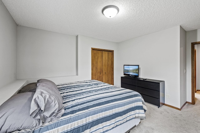 2801 263rd Ave NE, Isanti, MN 55040 - bedroom featuring a textured ceiling, light colored carpet, and a closet
